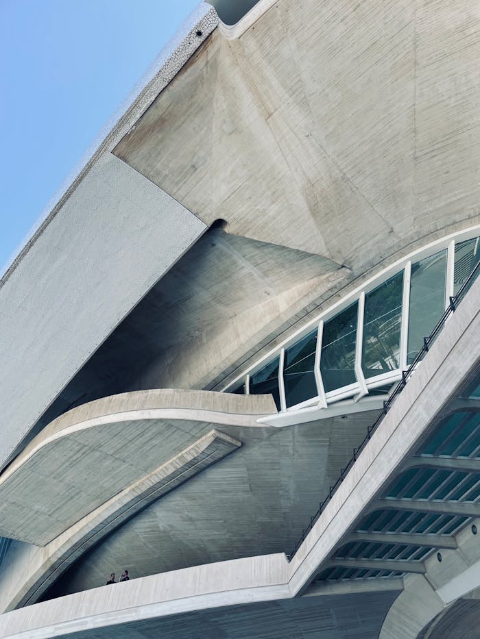 Detailed view of modern architectural design in Valencia, Spain, featuring curves and glass.